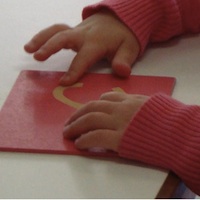 Handcraft - child's hands working with craft